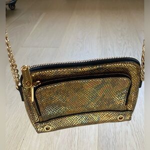 MILLY gold crossbody mini handbag with gold chain detail.